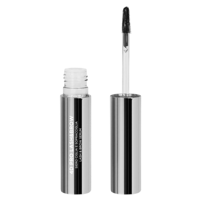 Sleek silver tube of lash and brow serum with the wand applicator removed, showing a black bristle brush on a clear stem.