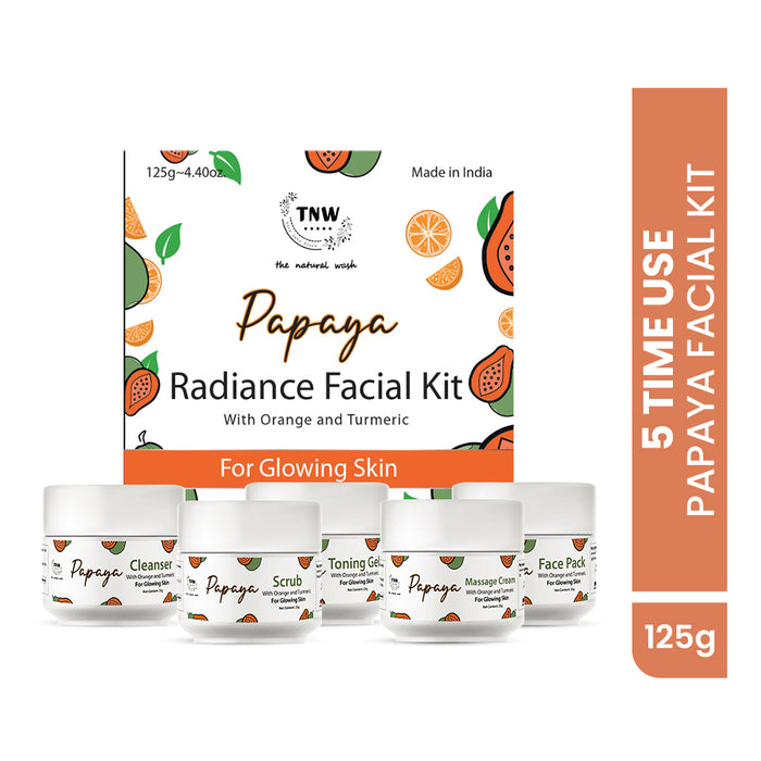 Packaging of TNW The Natural Wash Papaya Radiance Facial Kit, showing five product containers labeled as cleanser, scrub, toner, massage cream, and face mask, with the text '5 Time Use' and 'For Glowing Skin'. The packaging has orange and yellow color tones and mentions '125g'.