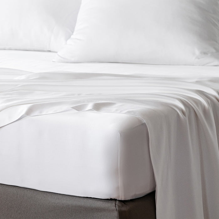 bambaw cozy bamboo bed sheets close up on a bed with fitted sheets and pillows in white colour