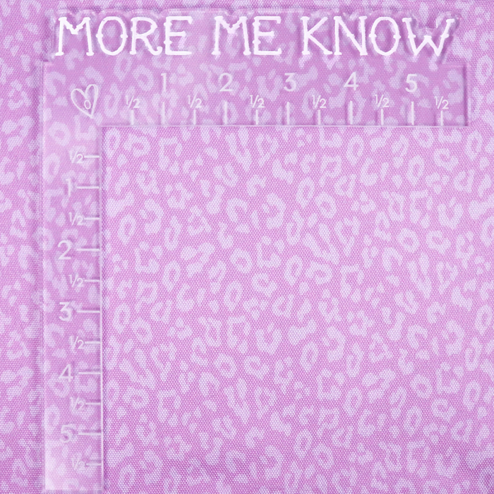 This printed WPC-Lite has a repeating light pink leopard print design with a deep saturated pink background. This photo shows an L shaped ruler for scale.