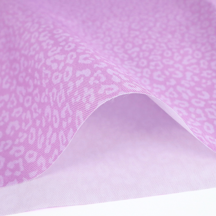 This printed WPC-Lite has a repeating light pink leopard print design with a deep saturated pink background.