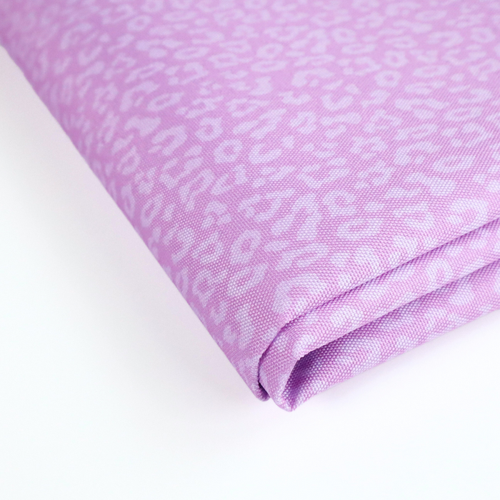 This printed WPC-Lite has a repeating light pink leopard print design with a deep saturated pink background. This photo shows the fabric folded.