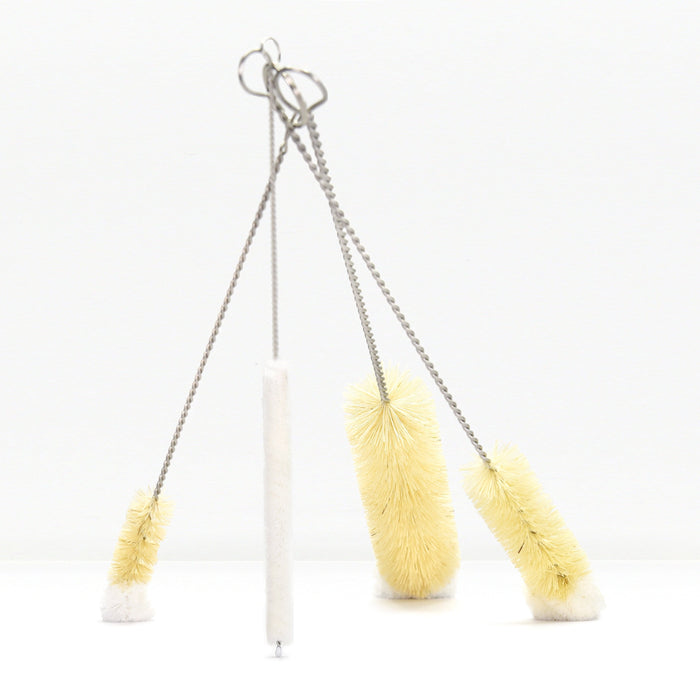 Set of five bottle brushes with twisted cords and metal hanging loops against a white background.