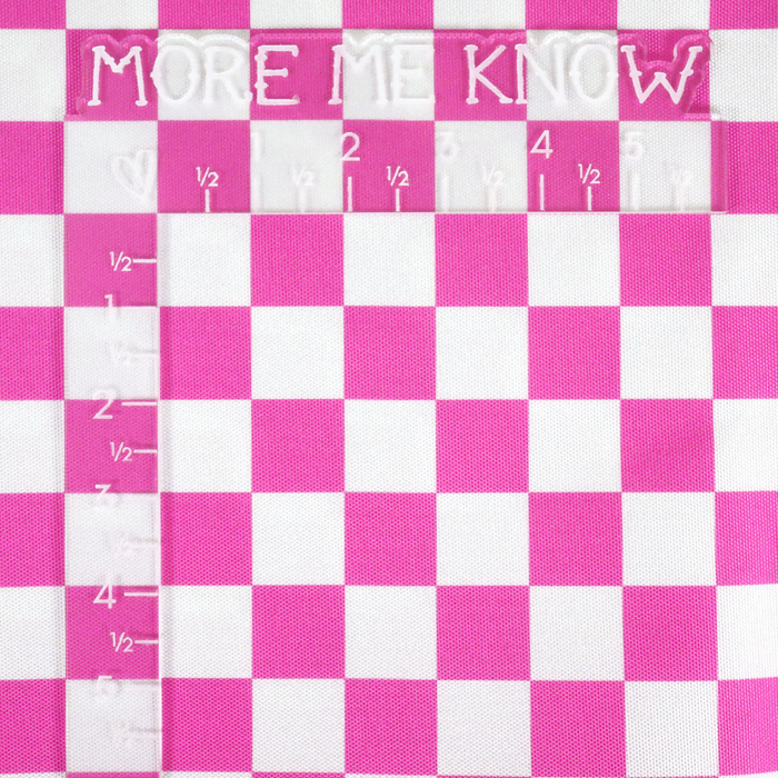 This printed WPC-Lite features a checkered pattern with deep pink and white squares. This photo shows an L shaped ruler for scale.