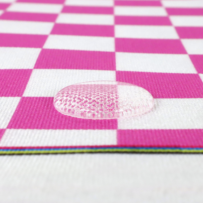 This printed WPC-Lite features a checkered pattern with deep pink and white squares. This photo shows a water drop on the fabric.