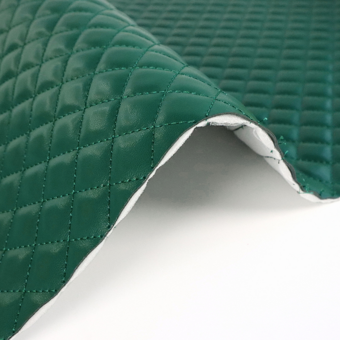 This pre-quilted vinyl is a saturated and deep shade of green.