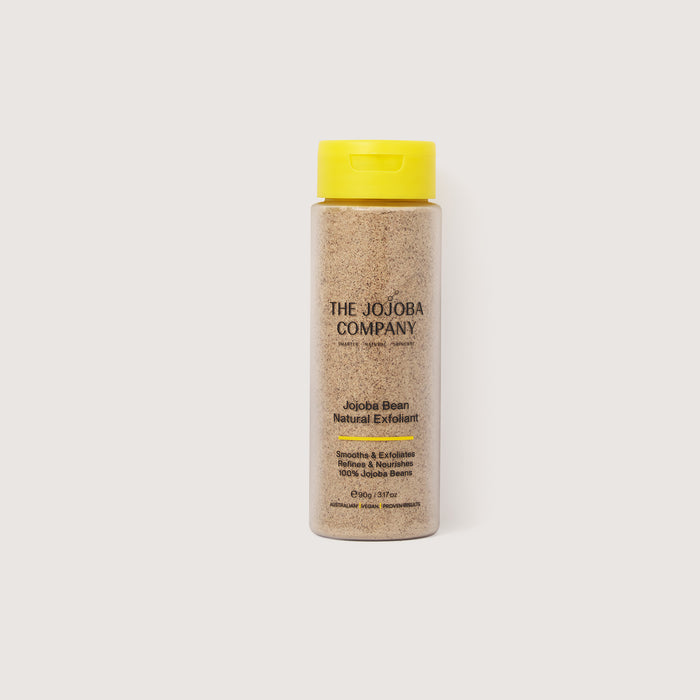 Bottle of The Jojoba Company product with a yellow cap on a white background