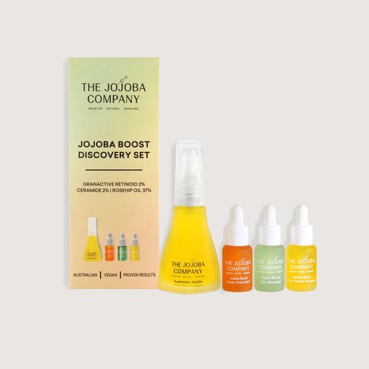 The Jojoba Company skincare discovery set with packaging on a light beige background