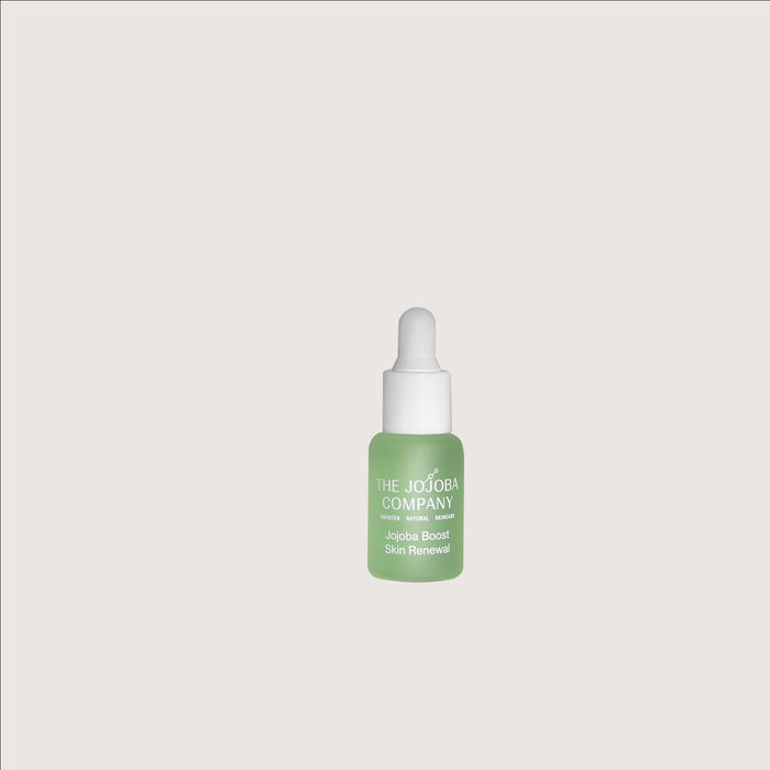 Jojoba Boost  Skin Renewal in travel mini Green skincare serum bottle with white cap on a light gray background