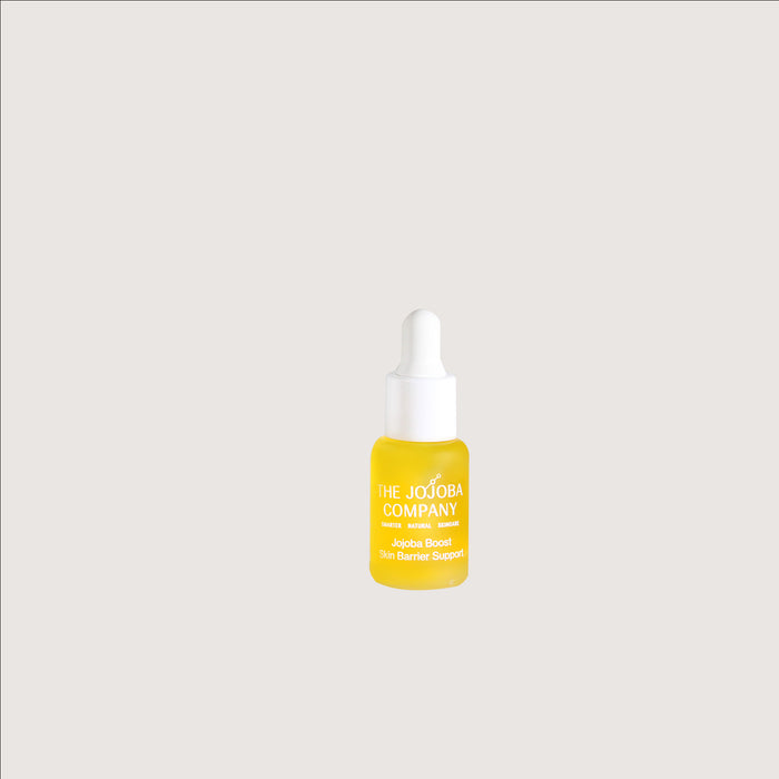 Jojoba Boost  Skin Barrier Support Travel Mini Yellow dropper bottle with white cap on a light gray background