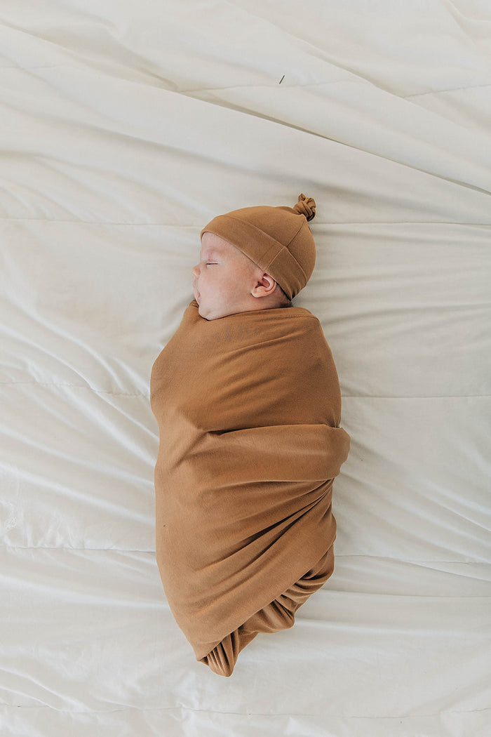 Mebie Baby Mustard Stretch Swaddle. Mebie Baby Bamboo Stretch Swaddle. Gender Neutral for take home outfits and swaddling newborns.