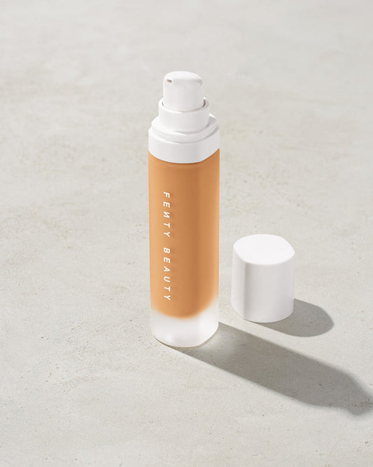 open bottle of Fenty Beauty Pro Filt'r Soft Matte Longwear Foundation with pump dispenser in shade #280 on concrete background