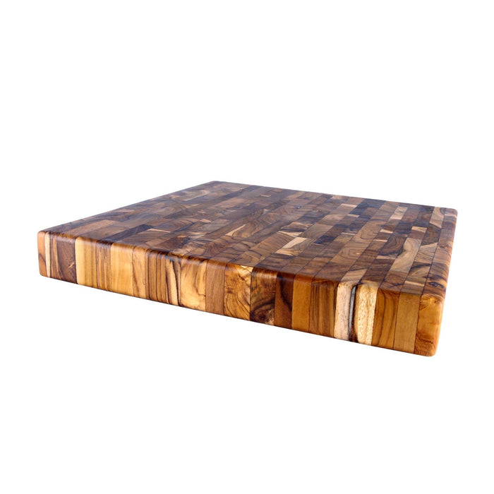 A rectangular, brown teak end grain cutting board with a visible grain pattern on a white background