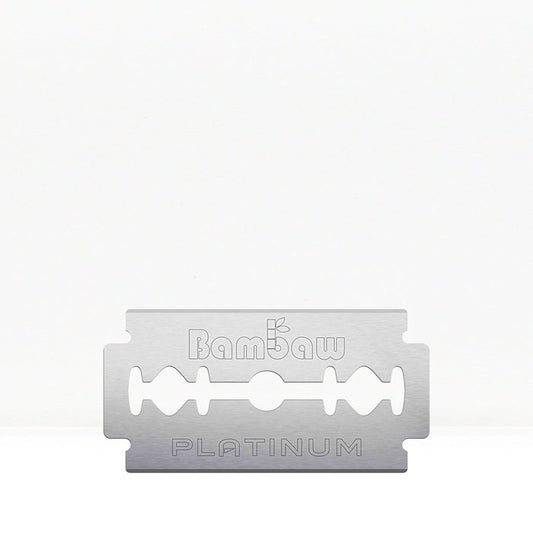 A single safety razor blade with platinum coating, with the brand name 'Bambaw' visible on it.