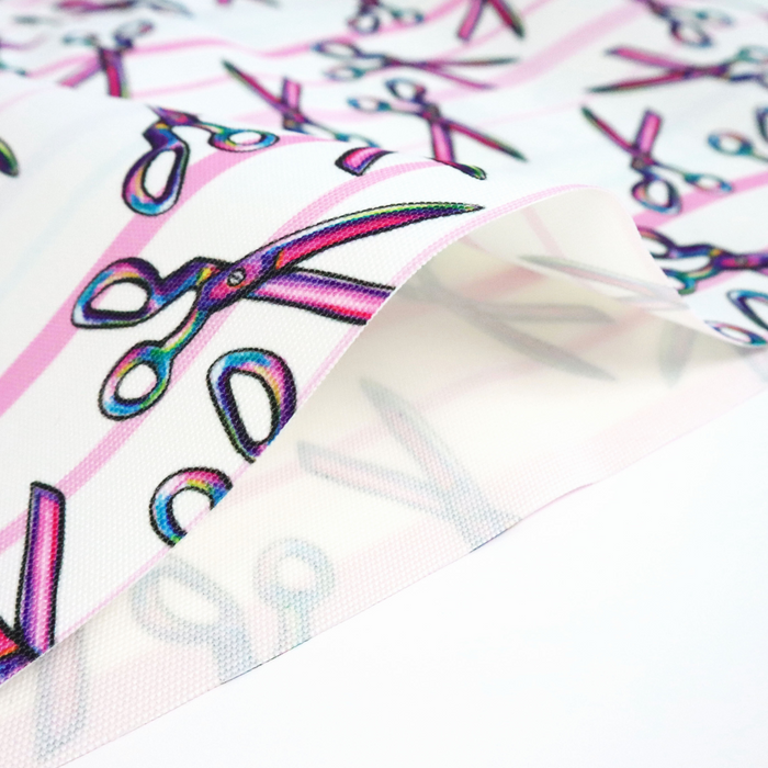 This ReNew Canvas print is of a rainbow scissors design over light blue, pink, and white stripes.