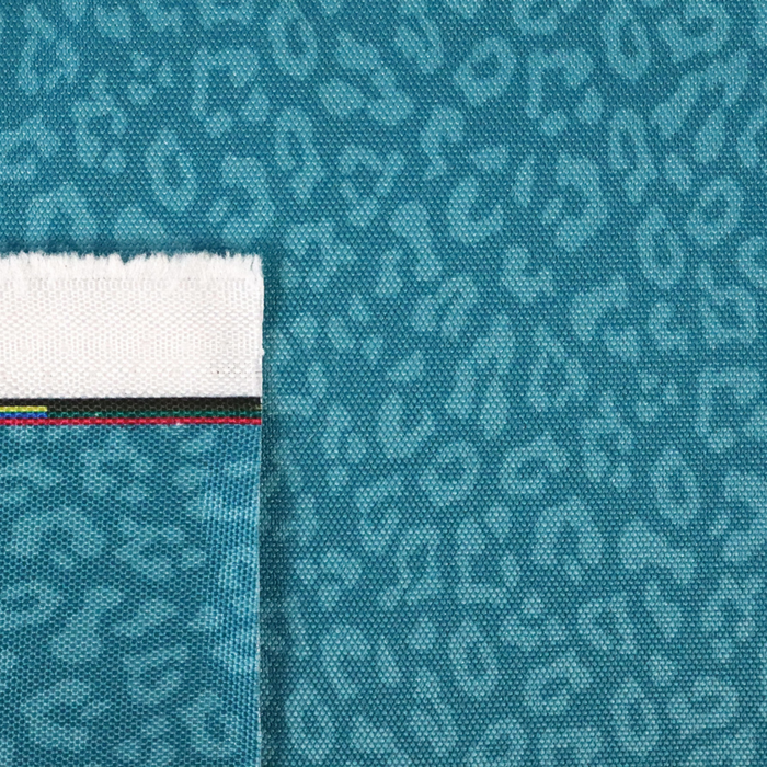 This printed WPC-Lite has a repeating light teal leopard print design with a deep saturated teal background.