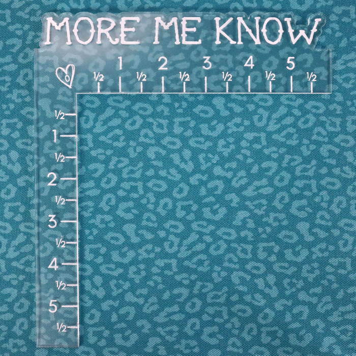This printed WPC-Lite has a repeating light teal leopard print design with a deep saturated teal background. This photo shows an L shaped ruler for scale.