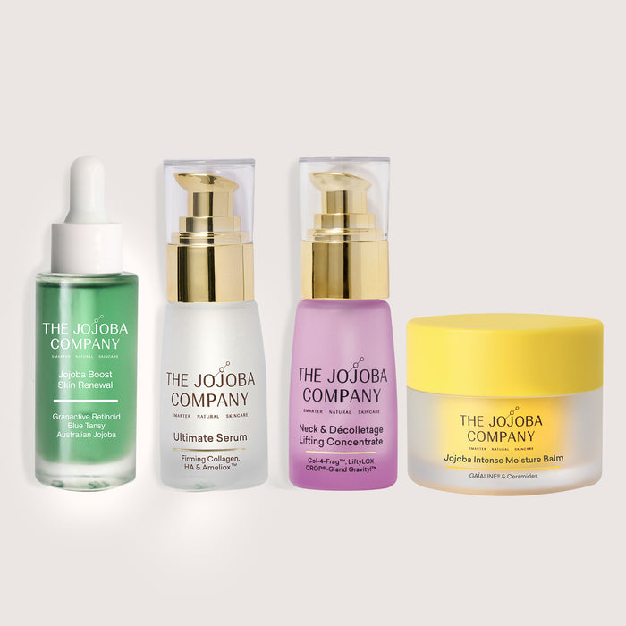 Set of skincare products from The Jojoba Company on a white background