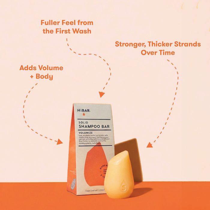 HIBAR solid shampoo bars  with packaging on a peach background with product highlights: Fuller feel from the first wash. More Volume + Body. Stronger, thicker strands over time.