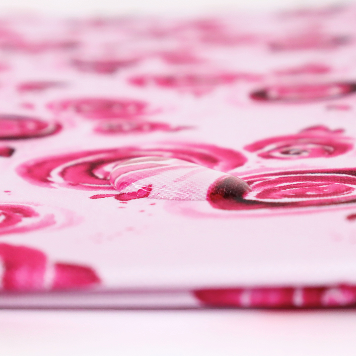 This printed WPC has a watercolor rose design in the magenta. This photo shows a water drop on the fabric.