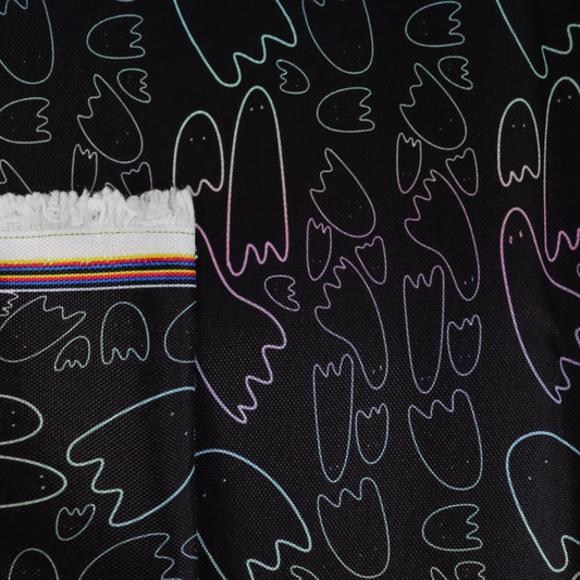 This printed WPC has pastel rainbow ghost outlines in different sizes on a black background.